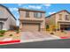 Two-story home with a two-car garage and desert landscaping at 1364 Cerulean Ave, Henderson, NV 89002