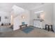 Bright and airy hallway with staircase and tasteful decor which connects the living spaces at 1364 Cerulean Ave, Henderson, NV 89002