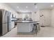 Modern kitchen featuring stainless steel appliances, granite countertops, and a convenient breakfast bar at 1364 Cerulean Ave, Henderson, NV 89002