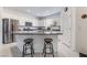 Well-equipped kitchen featuring stainless steel appliances, granite countertops, and ample cabinet space at 1364 Cerulean Ave, Henderson, NV 89002