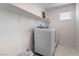 Compact laundry room with new washer and dryer and a shelf at 1364 Cerulean Ave, Henderson, NV 89002