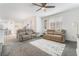 Inviting living room with comfortable seating, neutral decor, and plenty of natural light with access to kitchen at 1364 Cerulean Ave, Henderson, NV 89002