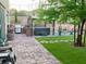 Entertainer's backyard features a spa, grill, patio and manicured lawn at 176 Brighton Hills Ave, Henderson, NV 89002