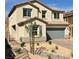 Charming two-story home with a two-car garage and low-maintenance desert landscaping at 176 Brighton Hills Ave, Henderson, NV 89002