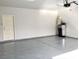 Spacious two-car garage with epoxy flooring at 176 Brighton Hills Ave, Henderson, NV 89002