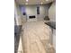 Open-concept living room boasts modern fireplace, light wood floors, neutral walls, and recessed lighting at 176 Brighton Hills Ave, Henderson, NV 89002