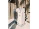 Side view of a Panasonic inverter air conditioner outside against stucco wall at 1828 Casa Vista Dr, Las Vegas, NV 89146