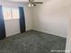 This cozy bedroom is illuminated by a ceiling fan, featuring neutral carpets and abundant natural light at 1828 Casa Vista Dr, Las Vegas, NV 89146