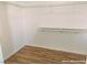 A clean closet with hardwood floors and built-in shelving offers simple storage solutions at 1828 Casa Vista Dr, Las Vegas, NV 89146