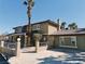 Two-story home featuring a gravel front yard, brick accents, and a covered front porch at 1828 Casa Vista Dr, Las Vegas, NV 89146