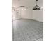 An open-concept living space with ample natural light showcases neutral walls and tiled floors at 1828 Casa Vista Dr, Las Vegas, NV 89146