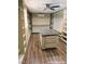Large walk-in closet island featuring custom drawers, shelving, and hardwood floors at 1828 Casa Vista Dr, Las Vegas, NV 89146