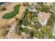 Manicured yard with mature landscaping on homesite overlooking lush golf course and neighboring homes at 2041 Troon Dr, Henderson, NV 89074