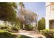 Relaxing backyard space with a tranquil garden, stone steps, and mature trees at 2041 Troon Dr, Henderson, NV 89074