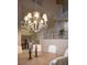 Elegant dining room featuring a decorative chandelier and neutral tones at 2041 Troon Dr, Henderson, NV 89074
