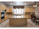 Spacious kitchen features granite countertops and light wood cabinets at 2041 Troon Dr, Henderson, NV 89074