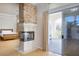 The main bedroom offers a cozy fireplace, access to a private balcony, and hardwood floors at 2041 Troon Dr, Henderson, NV 89074