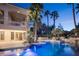 Enjoy the refreshing swimming pool, complete with a water feature and lush landscaping at 2041 Troon Dr, Henderson, NV 89074
