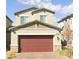 Charming two-story home featuring a two-car garage and neutral-toned exterior at 214 Vanhoy Ave, Henderson, NV 89011