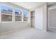 Bedroom with large windows and natural light, featuring carpet flooring and a sliding door closet at 2509 Silent View Ave, Henderson, NV 89044