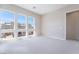 This bright bedroom boasts big windows with great views and neutral carpeting at 2509 Silent View Ave, Henderson, NV 89044
