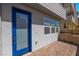 Inviting entryway with a blue glass door and brick paved porch at 2509 Silent View Ave, Henderson, NV 89044