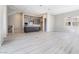 Open-concept living area with a modern kitchen and hardwood flooring at 2509 Silent View Ave, Henderson, NV 89044