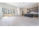 Bright, open living space with sliding glass doors and a modern kitchen at 2509 Silent View Ave, Henderson, NV 89044