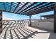 Large rooftop patio showcasing a pergola structure against a backdrop of blue skies and mountain views at 2509 Silent View Ave, Henderson, NV 89044
