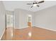 Spacious bedroom featuring wood floors and neutral walls, with glimpses of adjoining rooms at 2526 Evansville Ave, Henderson, NV 89052