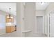 Hallway view with a glimpse of the kitchen with wood cabinets at 2526 Evansville Ave, Henderson, NV 89052