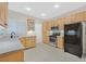 Bright kitchen with stainless steel appliances and tile flooring at 2526 Evansville Ave, Henderson, NV 89052