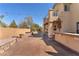 Spacious backyard featuring a covered patio and plenty of space for entertaining at 2566 Antique Blossom Ave, Henderson, NV 89052