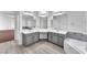 Open bathroom design with double sinks, grey vanity, and renovated tile at 2566 Antique Blossom Ave, Henderson, NV 89052