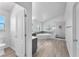 Renovated bathroom with gray vanity, natural light, soaking tub, and glass enclosed shower at 2566 Antique Blossom Ave, Henderson, NV 89052