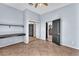 Bedroom showcasing light blue walls, a closet with mirror doors, and an open doorway at 2566 Antique Blossom Ave, Henderson, NV 89052