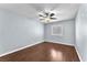 A bright bedroom features hard surface floors, neutral paint, and a ceiling fan at 2566 Antique Blossom Ave, Henderson, NV 89052