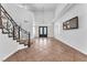 Elegant foyer with wrought iron staircase and lots of natural light at 2566 Antique Blossom Ave, Henderson, NV 89052