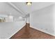 Hallway showcasing hardwood floors, bright neutral walls, and an open balcony overlooking below at 2566 Antique Blossom Ave, Henderson, NV 89052