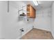A utility area offers overhead shelving and storage in a well lit space at 2566 Antique Blossom Ave, Henderson, NV 89052