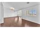 Bright living room with hardwood floors and lots of natural light shining through the plantation shutters at 2566 Antique Blossom Ave, Henderson, NV 89052