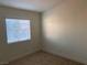 Bedroom featuring a window with blinds allowing plenty of natural light at 2621 Adelante Ave # 102, Las Vegas, NV 89106