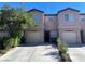 Charming two-story townhome with attached garage and mature landscaping at 2621 Adelante Ave # 102, Las Vegas, NV 89106