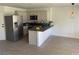 Bright kitchen with stainless steel appliances, modern countertops and flooring at 2621 Adelante Ave # 102, Las Vegas, NV 89106