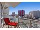Private balcony offers stunning views of the city skyline, with a lounge chair at 2700 Las Vegas Blvd # 1202, Las Vegas, NV 89109