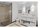 Elegant bathroom features a glass shower, stylish vanity with ample storage, and tiled floors at 2700 Las Vegas Blvd # 1202, Las Vegas, NV 89109