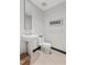Compact powder room features a pedestal sink, toilet, and modern accents at 2700 Las Vegas Blvd # 1202, Las Vegas, NV 89109