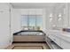 Spa-like bathroom showcases a soaking tub with window views, marble counters and modern fixtures at 2700 Las Vegas Blvd # 1202, Las Vegas, NV 89109