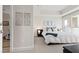 Well-lit bedroom boasts carpet floors, modern art and direct access to an ensuite bathroom at 2700 Las Vegas Blvd # 1202, Las Vegas, NV 89109