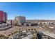 Breathtaking city view from a rooftop terrace with palm trees and stylish lounge areas at 2700 Las Vegas Blvd # 1202, Las Vegas, NV 89109
